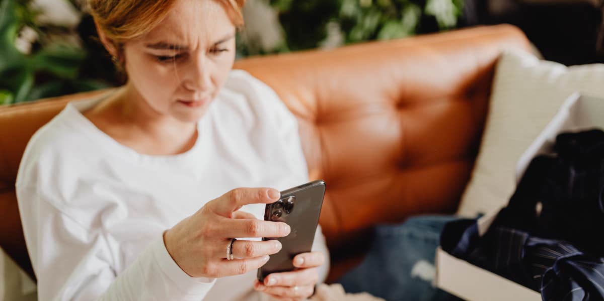 The First Person Most People Call After A Bad Break-Up, According To Research woman on her phone