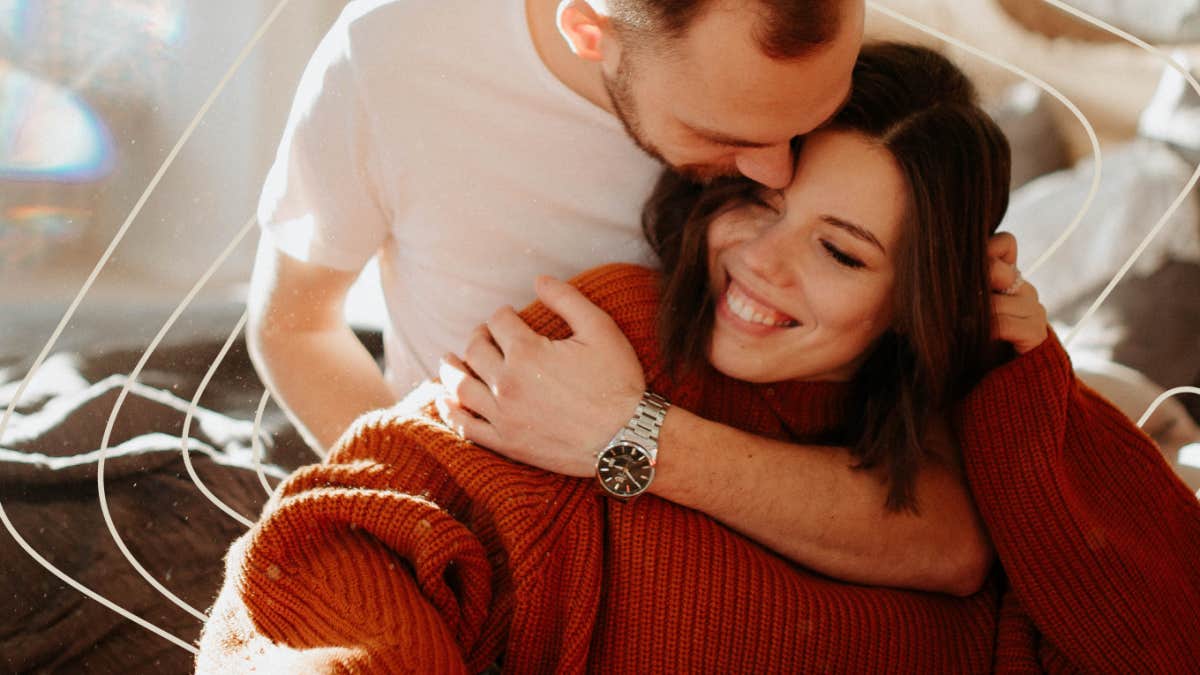Four letters that can actually prevent a divorce when you use them right Couple embracing