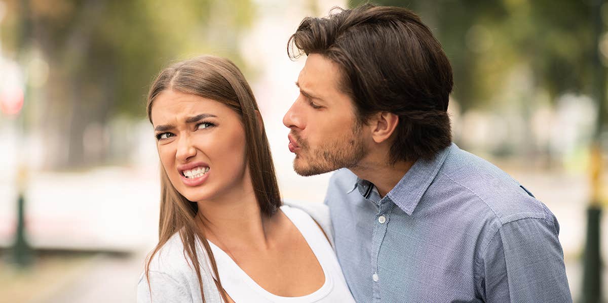 Girl Rejecting To Kiss Guy On Unsuccessful Date Walking Outside In Park.