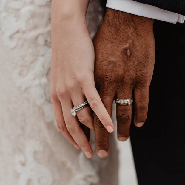 bride and groom holding hands