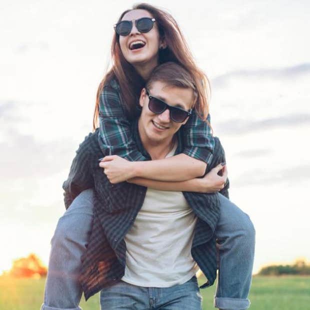 guy giving girl a piggy back ride