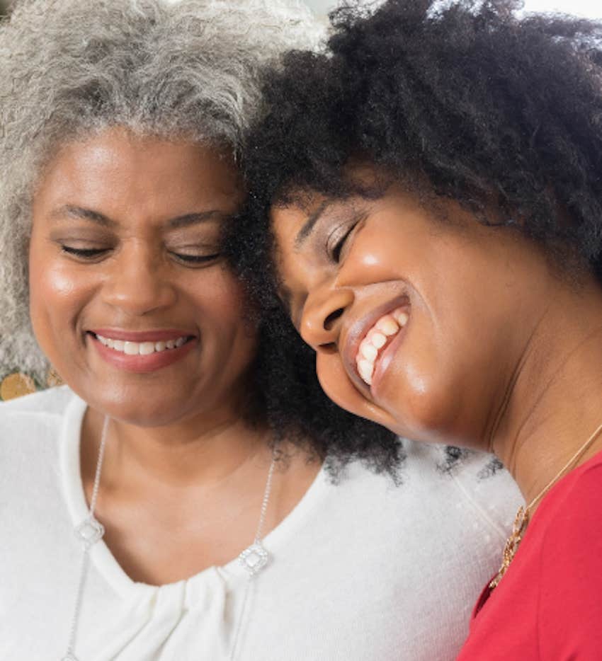 mother and daughter hold closely