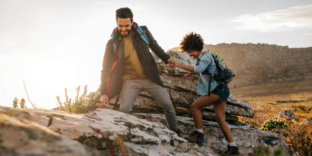 man and woman hiking mountain