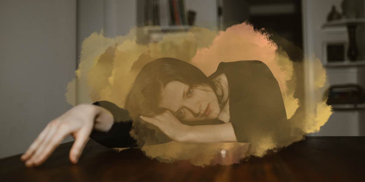 How Long Does It Take To Get Over A Breakup? Lies We Tell Ourselves That Prolong A Broken Heart Woman laying on desk consumed by her thoughts, post breakup