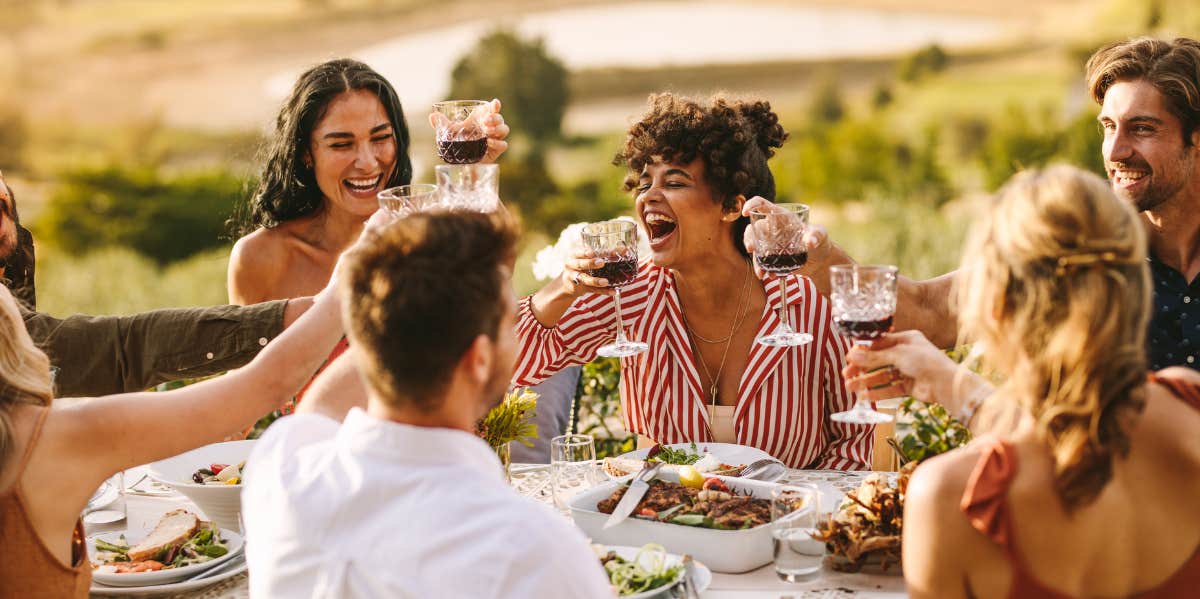 friends enjoying a outside lunch together