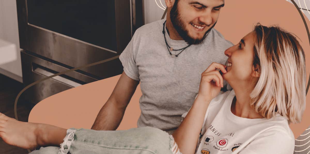 couple being silly on their kitchen floor