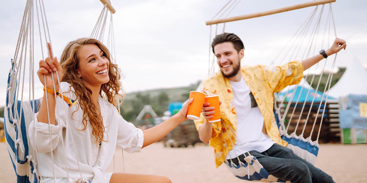 Young and cheerful couple at a music festival. 