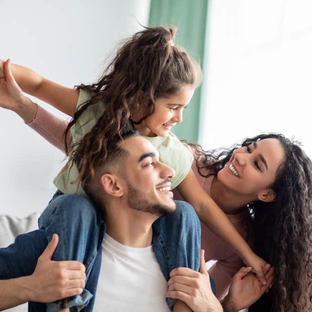 parents playing with young daughter