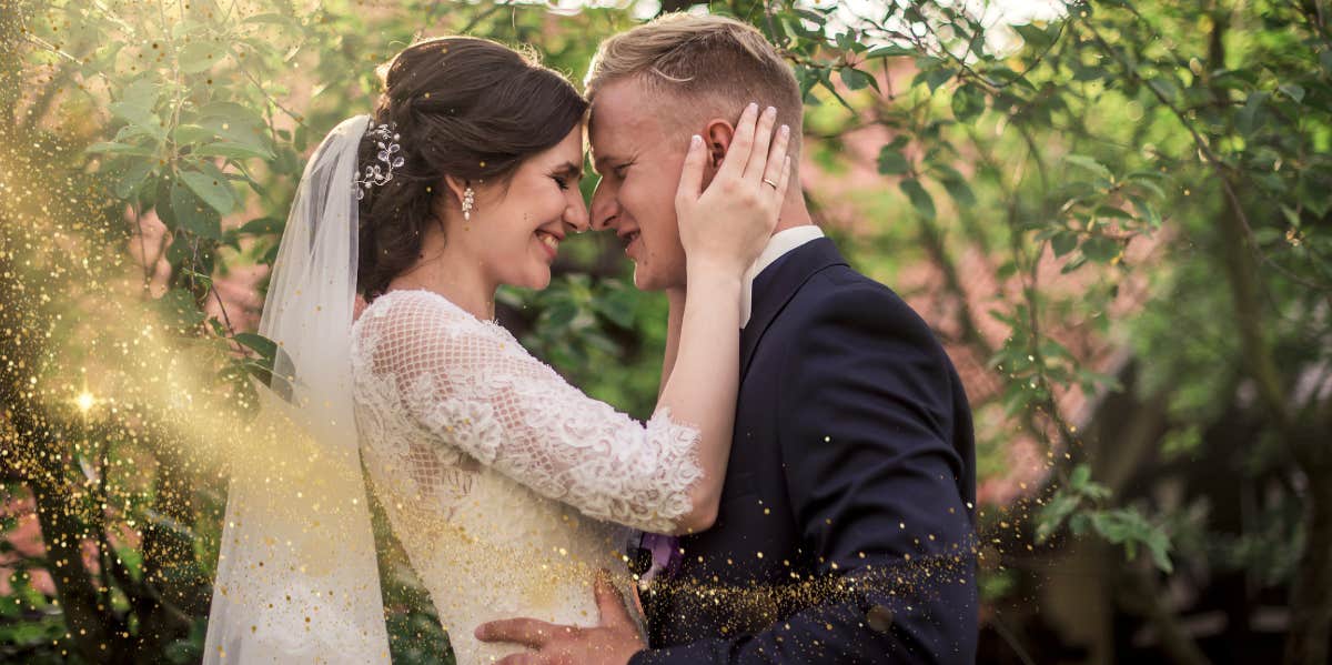 groom and bride embracing each other 