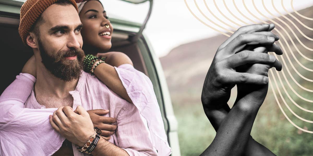 Couple snuggling together in the truck of a open van 