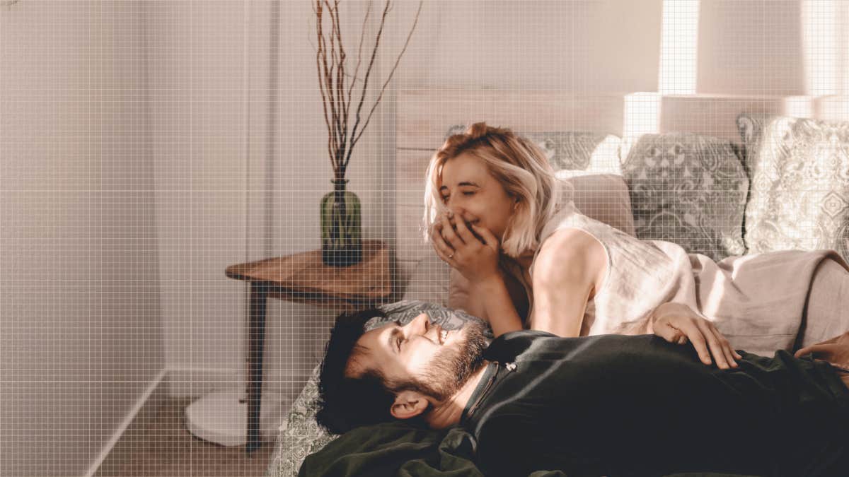 couple laughing together in bedroom