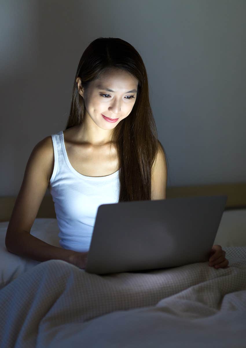 woman relaxing on laptop