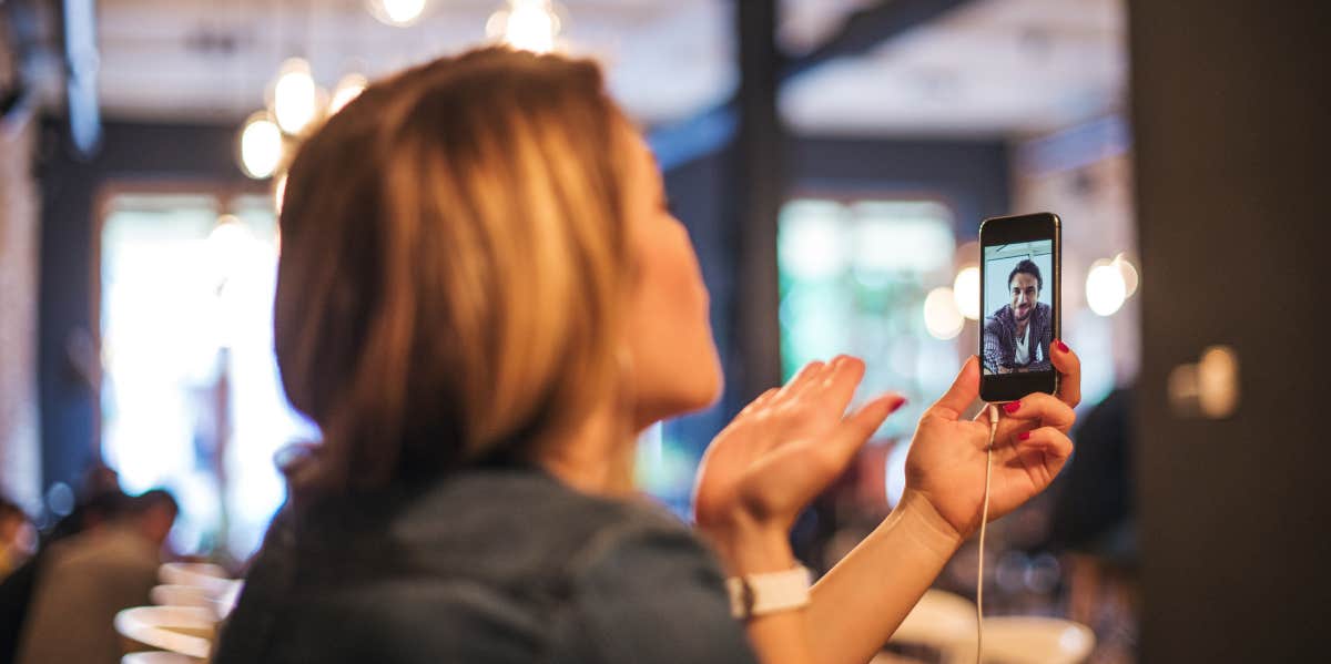 Why Long-Distance Couples Have Happier Relationships, According To Research Woman chatting with her long distance boyfriend via facetime