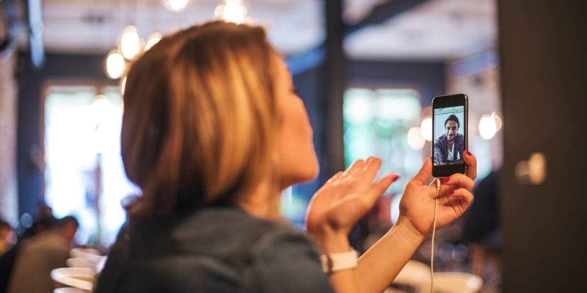 Woman chatting with her long distance boyfriend via facetime