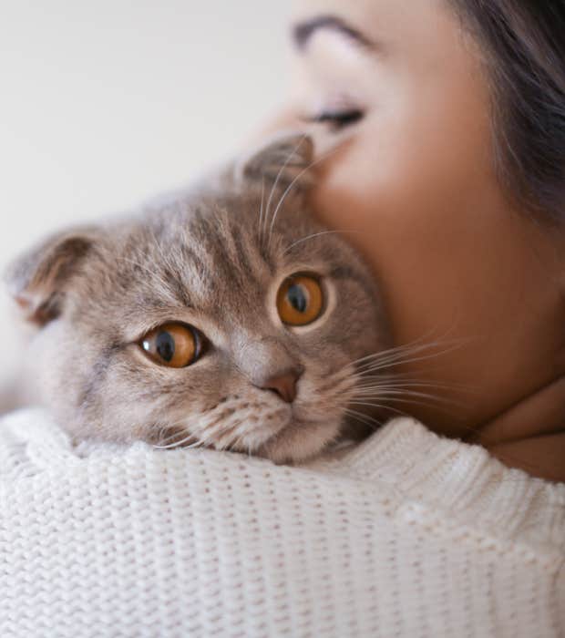 woman holding a cat