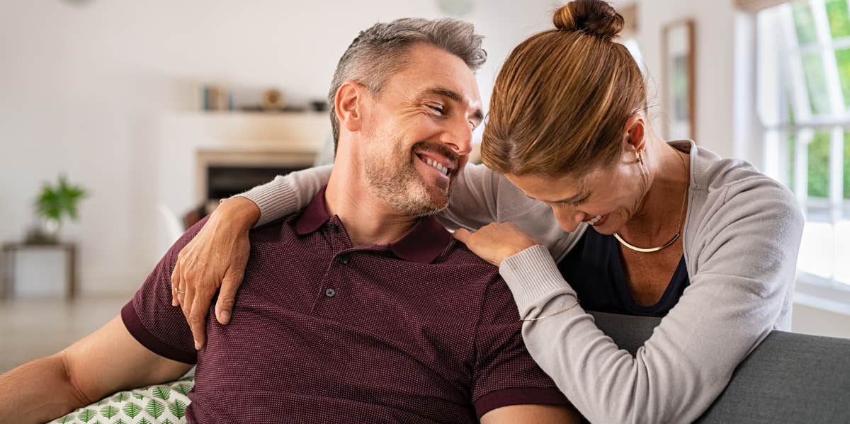 empty nesters, laughing together after romantic time together