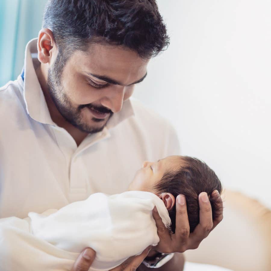 man holding infant