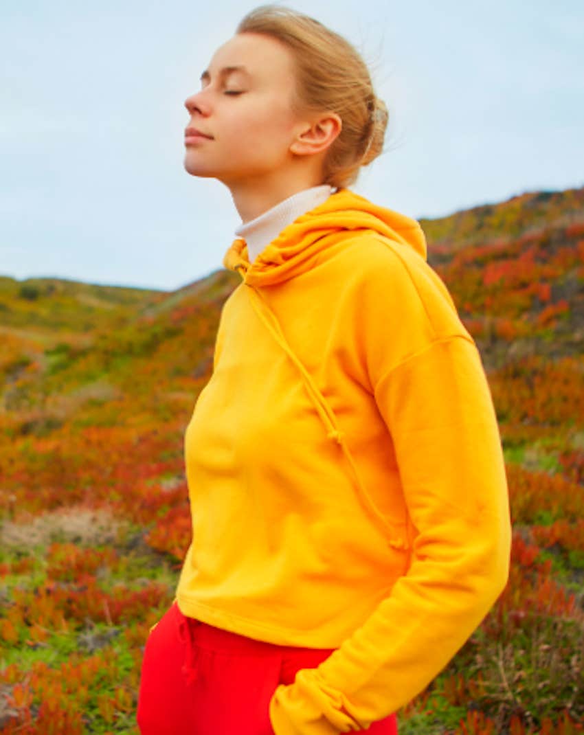 peaceful woman in alpine meadow