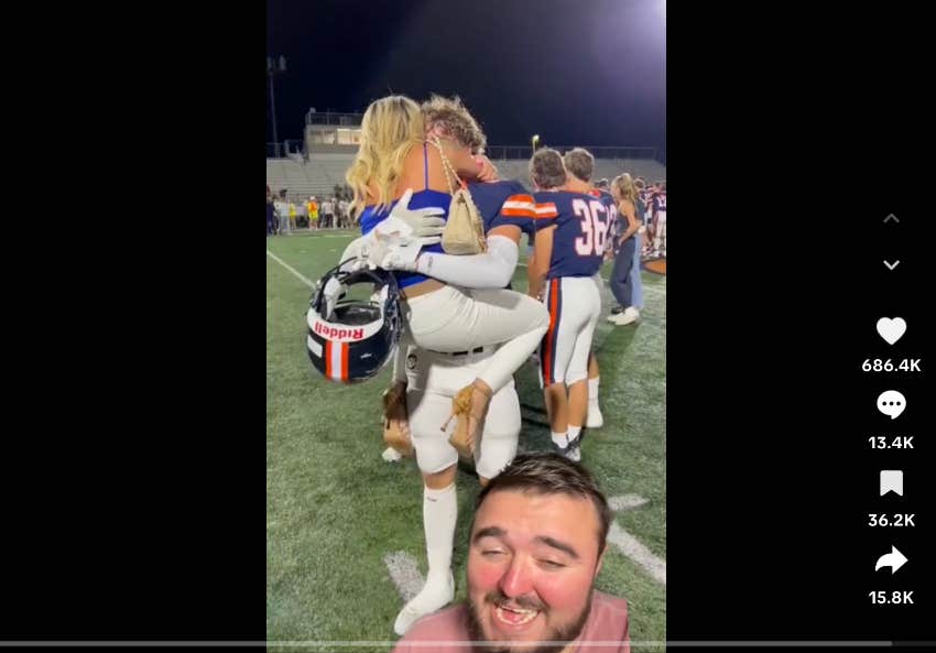 mom hugging son after football game