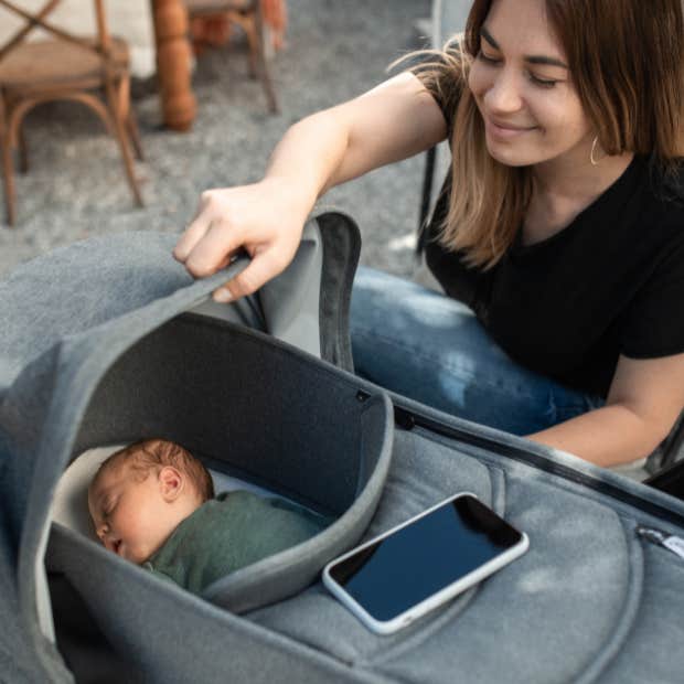 mom knocks strangers hand away after she touches baby without permission