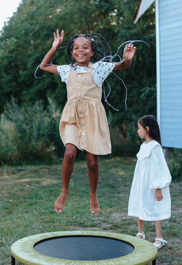 little girls jumping on trampoline