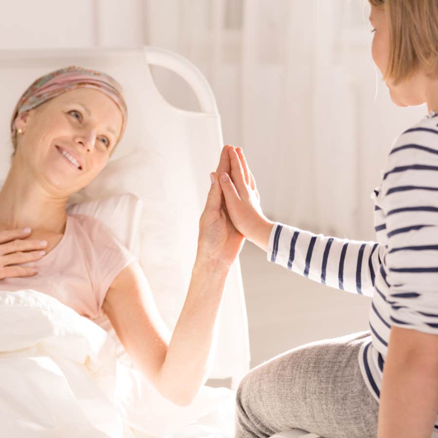 woman in hospital bed with wrap on hair