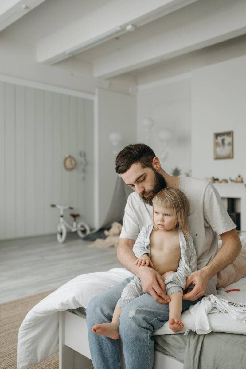 man sitting with a young child