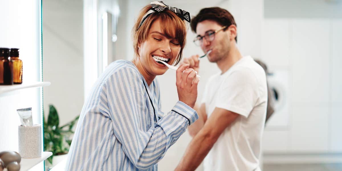 Couple brushing teeth getting ready for bed