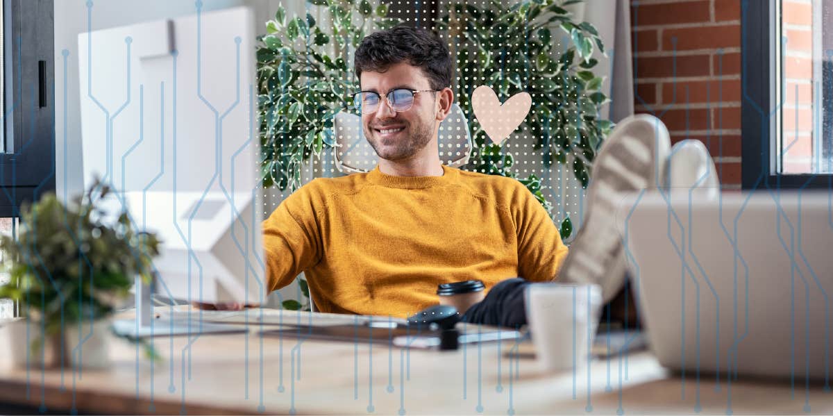 man with glasses on computer at work