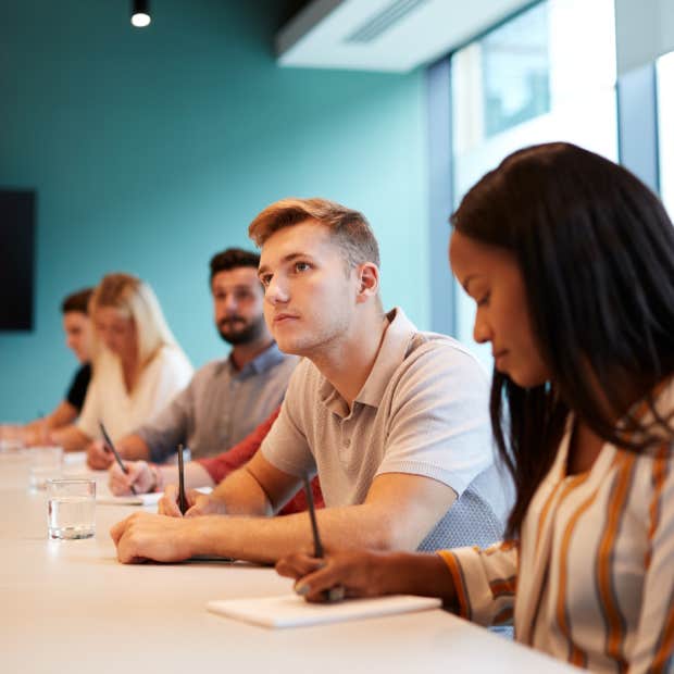 recruiter conducts job interview with both candidates at the same time