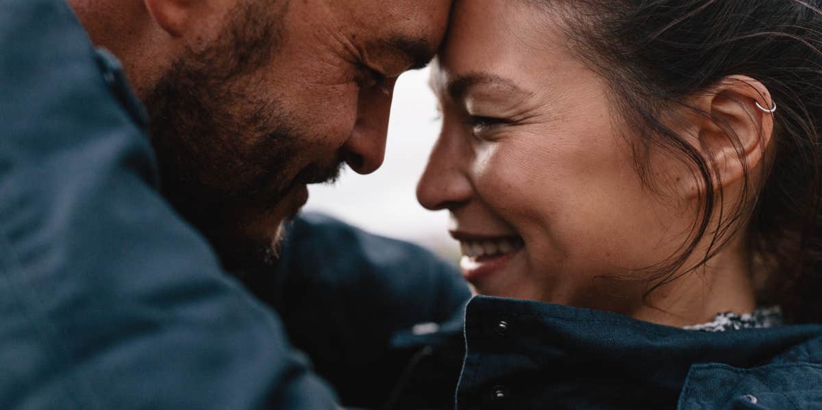 couple embracing at the forehead