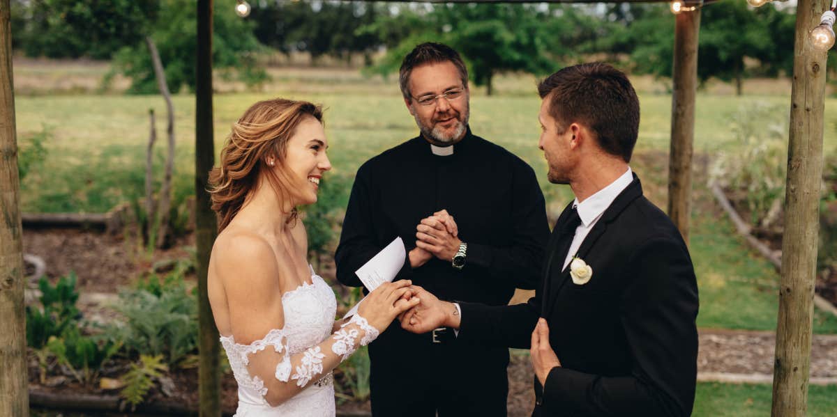 Bride and Groom on wedding day reading vows