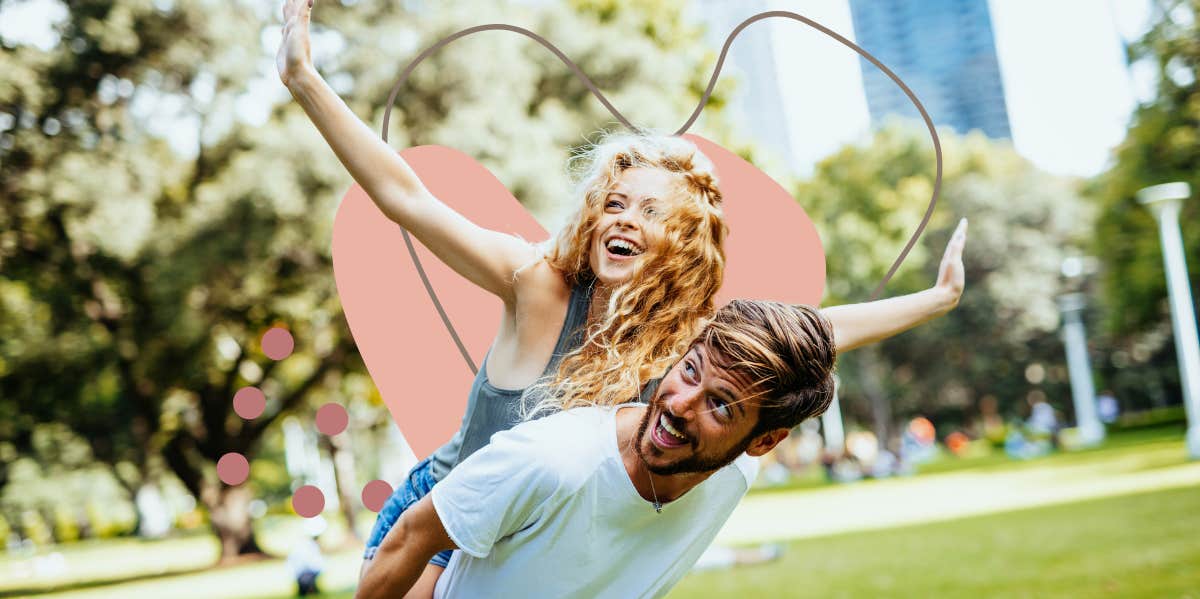 happy couple being playful in the park on a sunny day