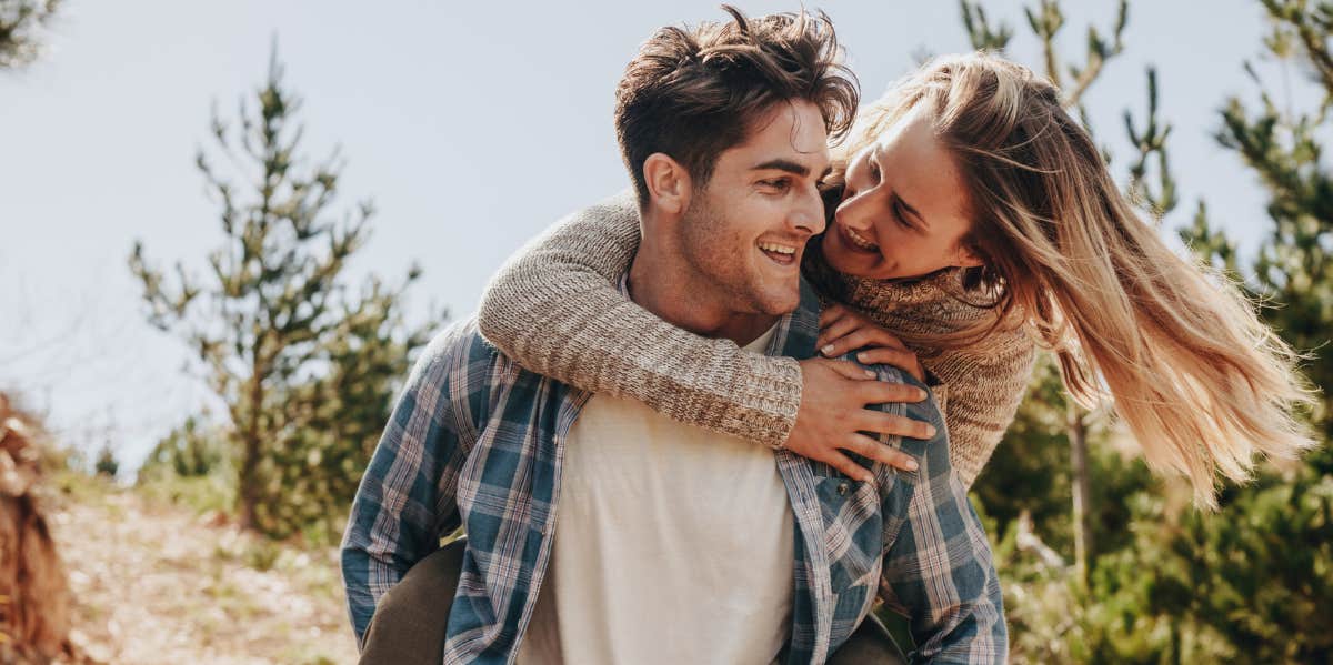 f A Guy Ever Does Any Of These 8 Things In A Relationship, He's Not A Good Man woman on the back of her boyfriend, playful
