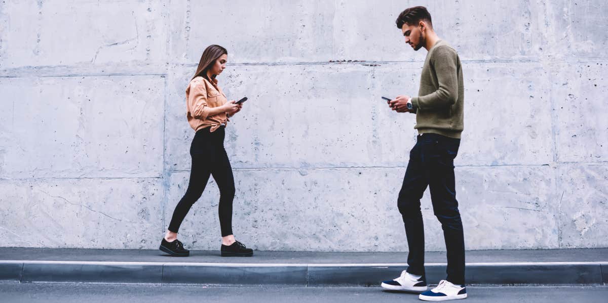 4 Signs You're Falling Into A Loveless Marriage Young couple walking past each other, ignoring