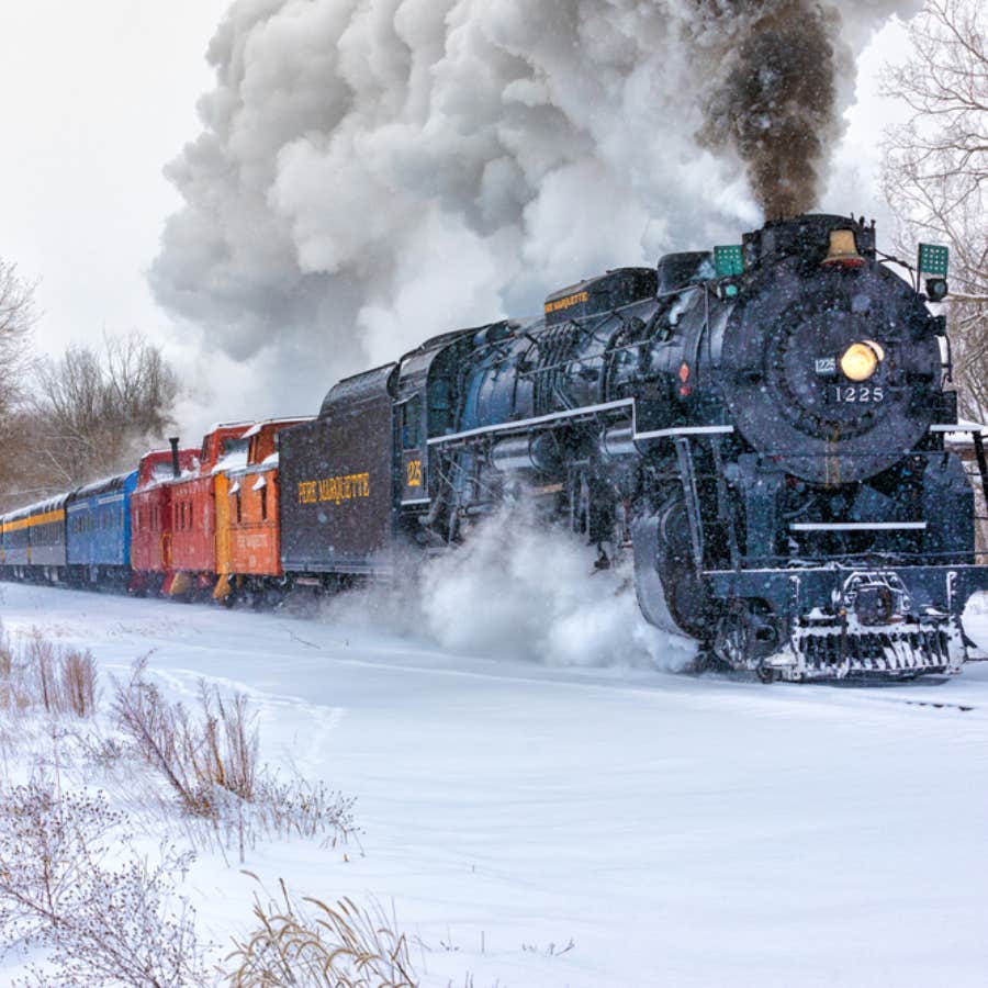 train riding the tracks in the snow