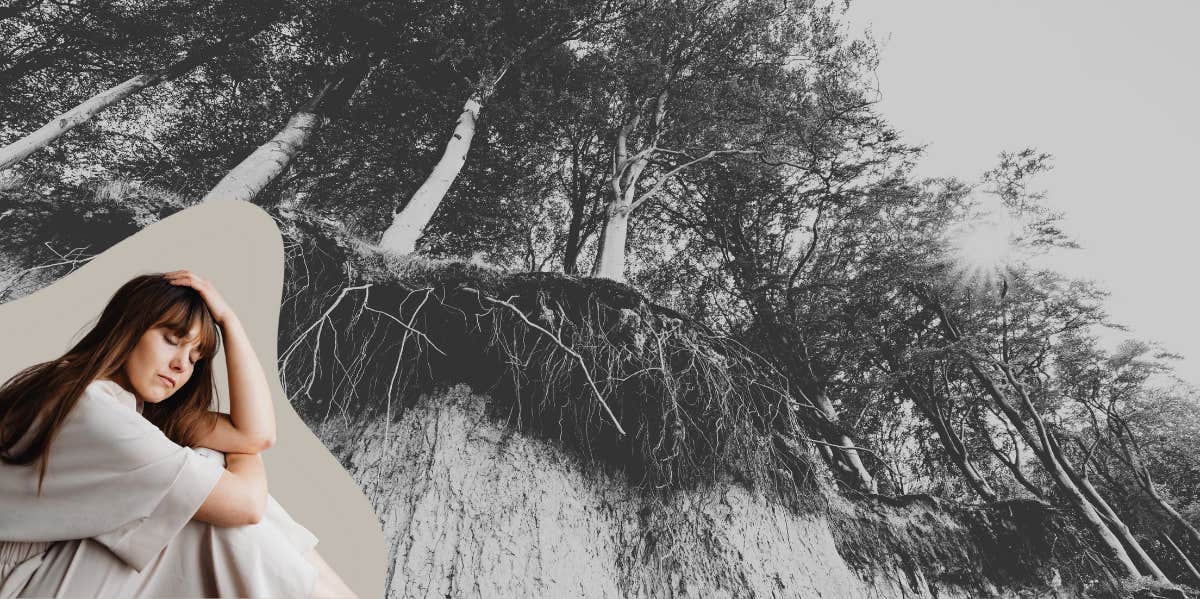 Woman sitting under a confused as the ground above her crumbles