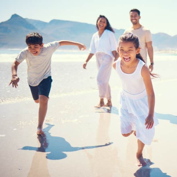 A happy family spending time together at the beach.