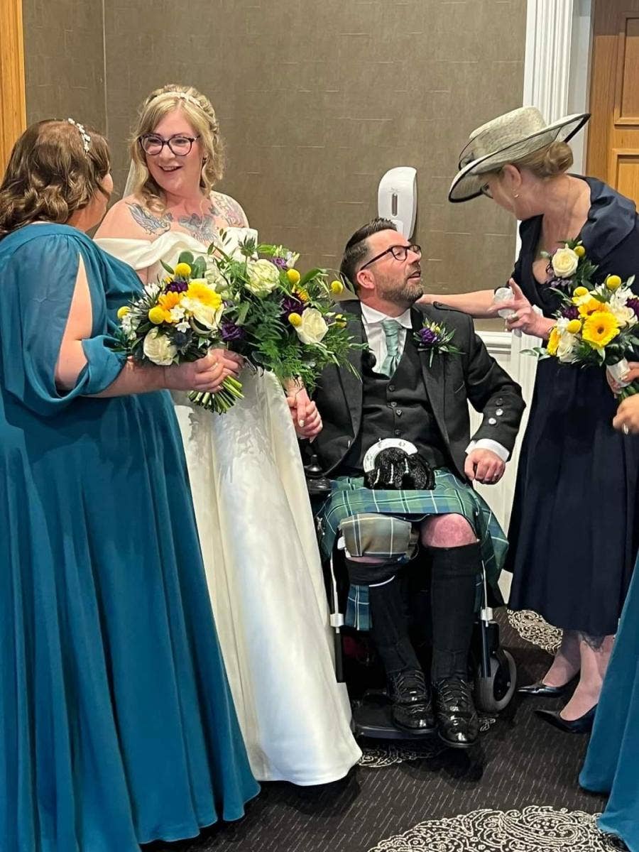 groom with MS stands up for first dance