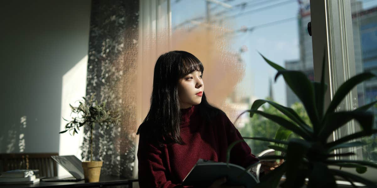 What It’s Like Being An Agoraphobic Mom Who Never Leaves The House woman sitting by window looking outside