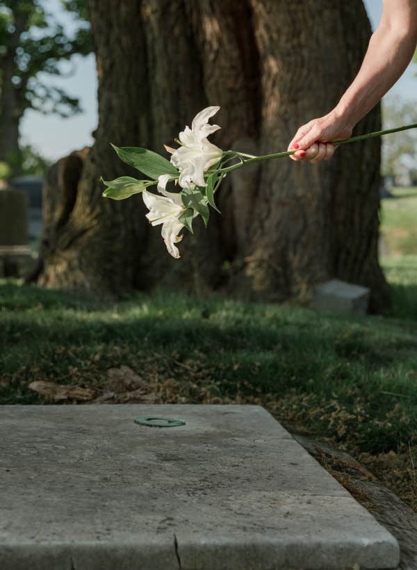 person holding flowers outside