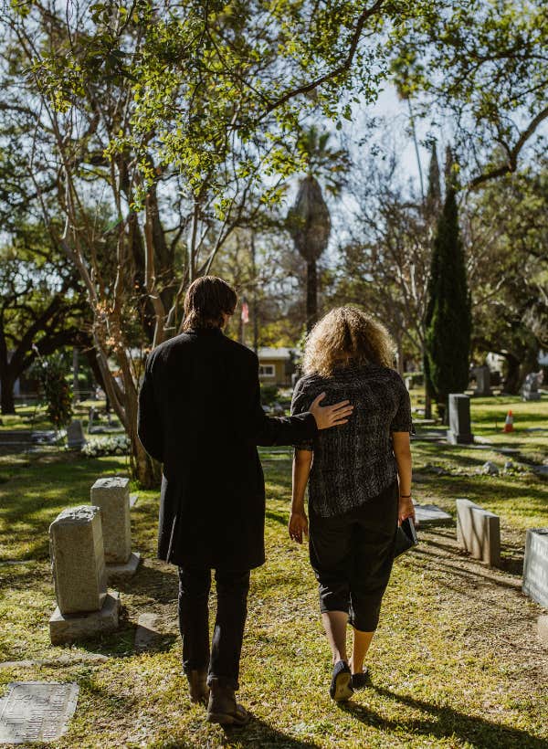 people walking in graveyard