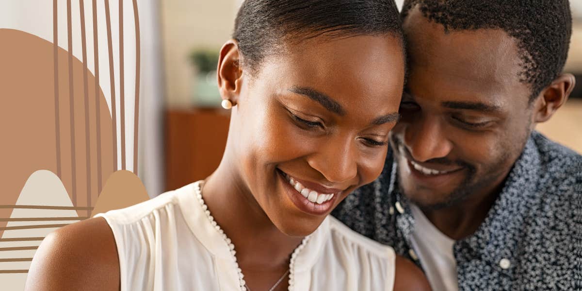 Man whispering affirmations in girls ear, as she smiles