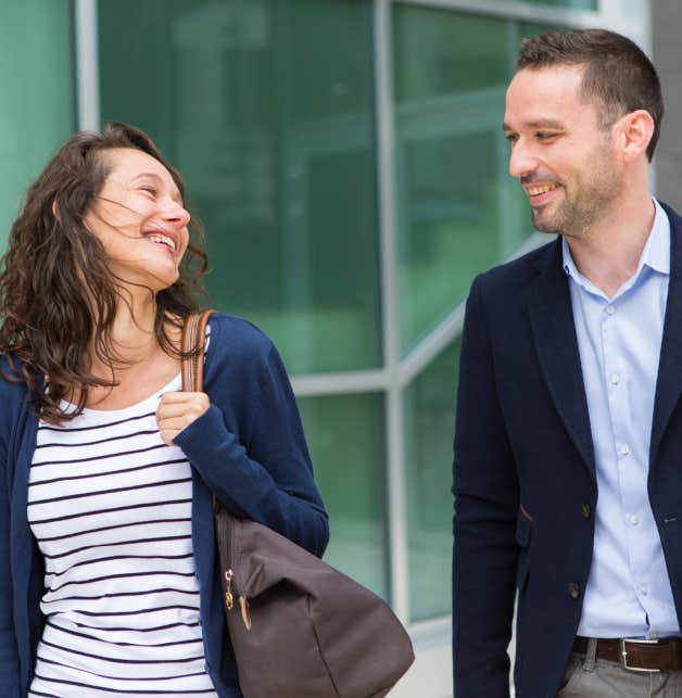 man and woman smiling at each other