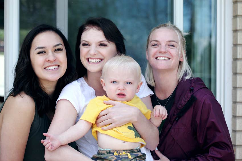 young women holding a baby