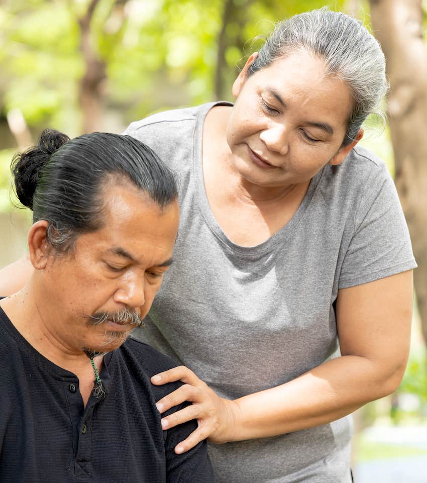 woman helping husband