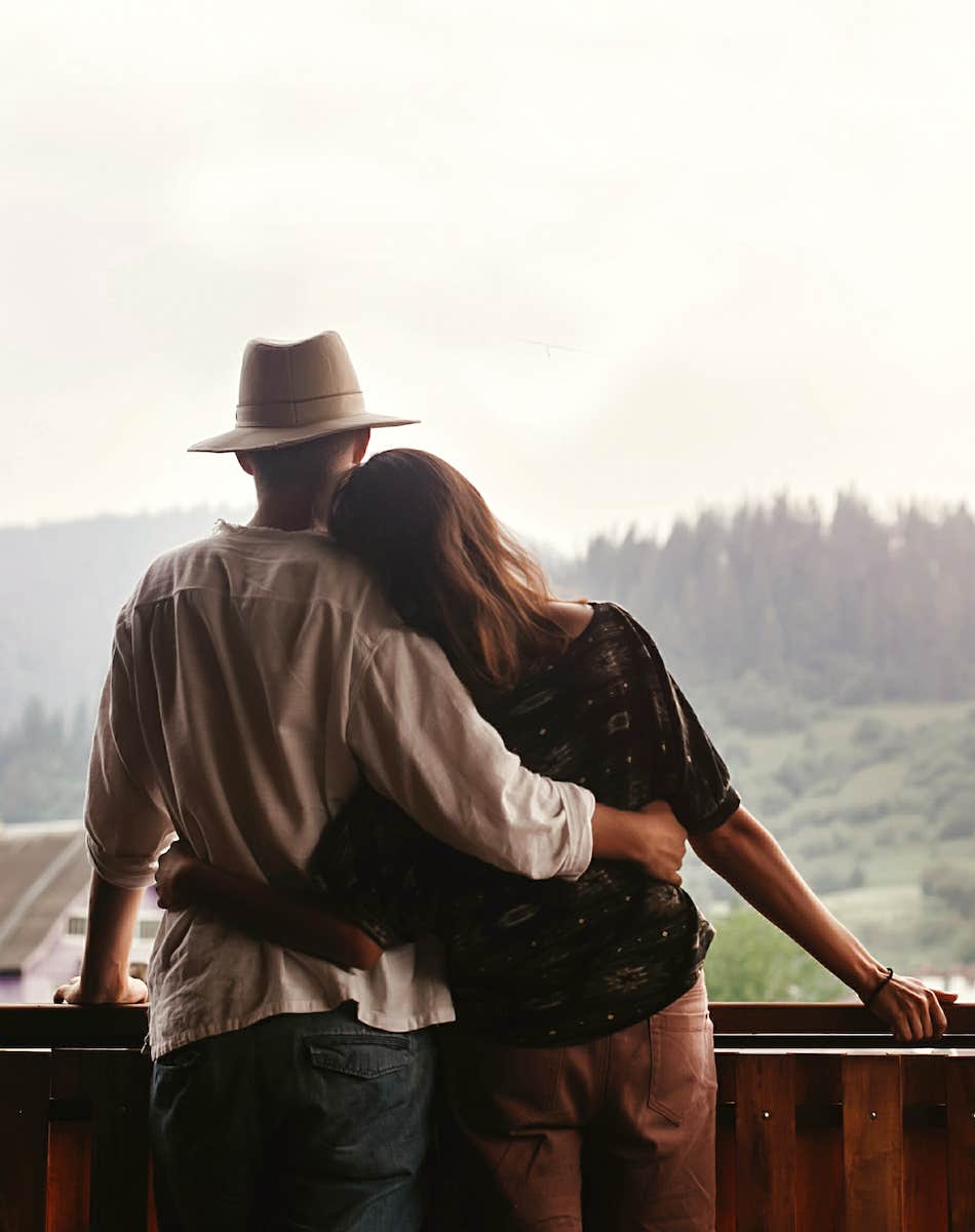 couple side hug while enjoying the view