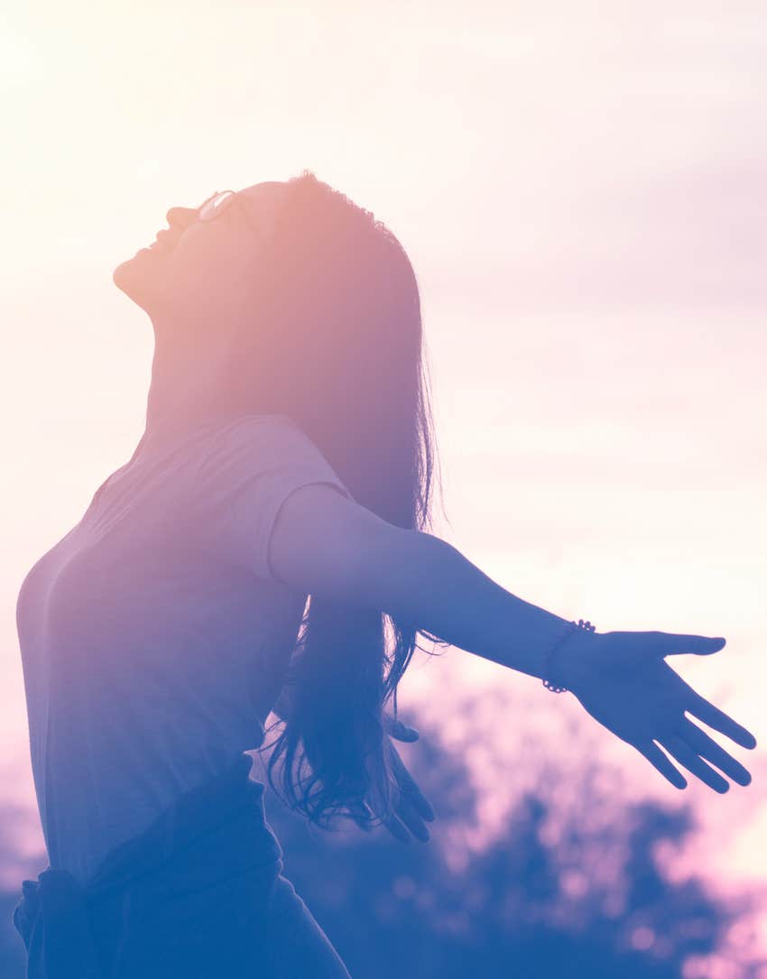 woman open to balance in soft light