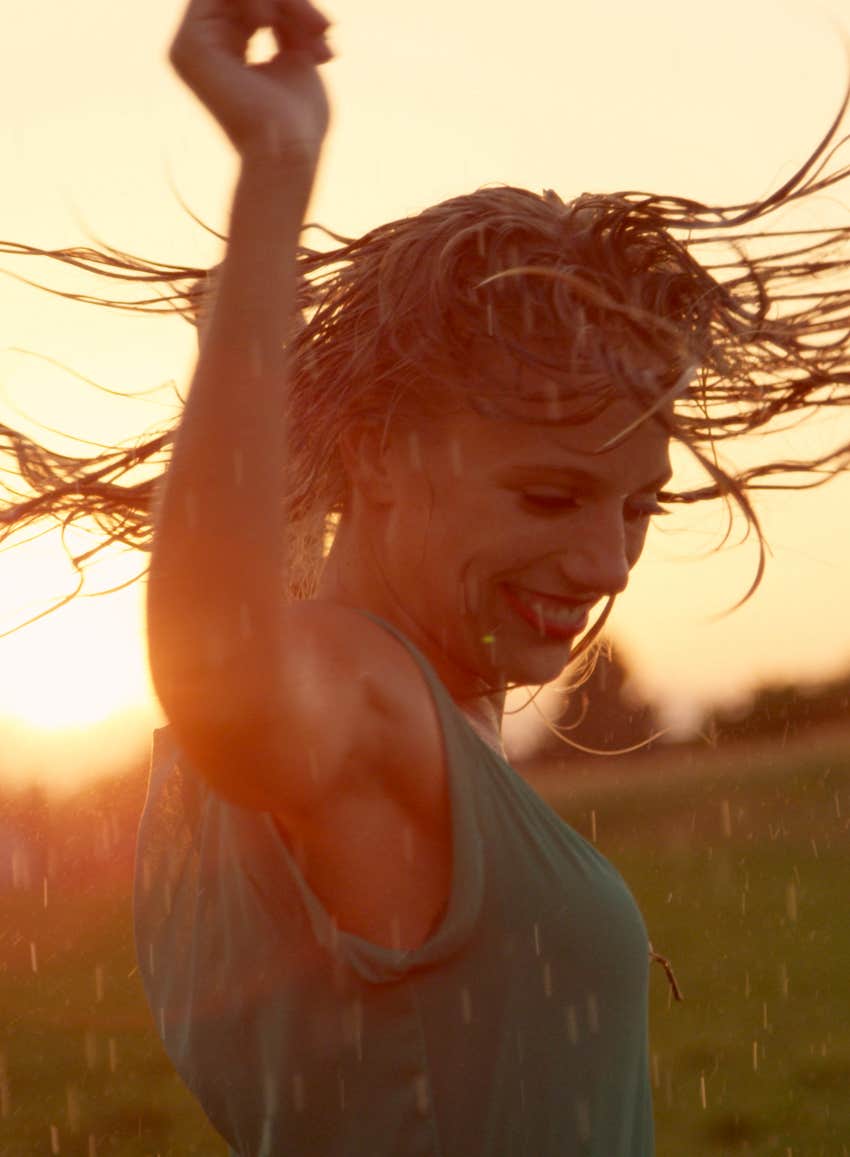 dancing in the rain at sunset