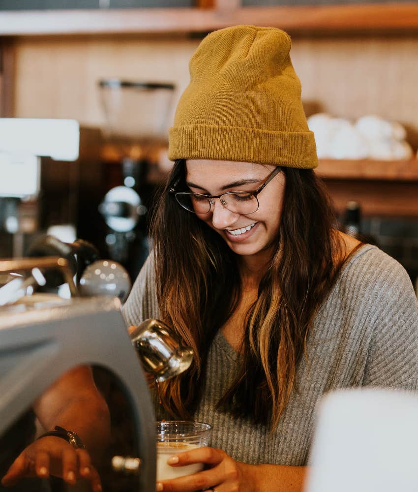 barista using an espresso machine